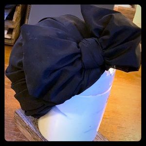 Turban style hat with large bow in the front